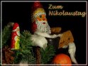 Grusskarte zum Nikolaus mit Nikolausstiefel, Tannenzweig und Süssigkeiten